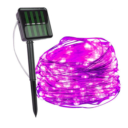 Pink copper wire fairy lights with a solar panel on a ground stake — Casa Norex