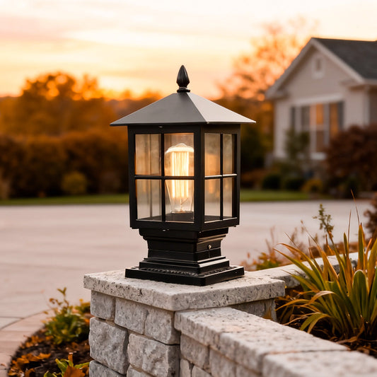 Wren classic black pillar light with warm light at a driveway entrance | Casa Norex