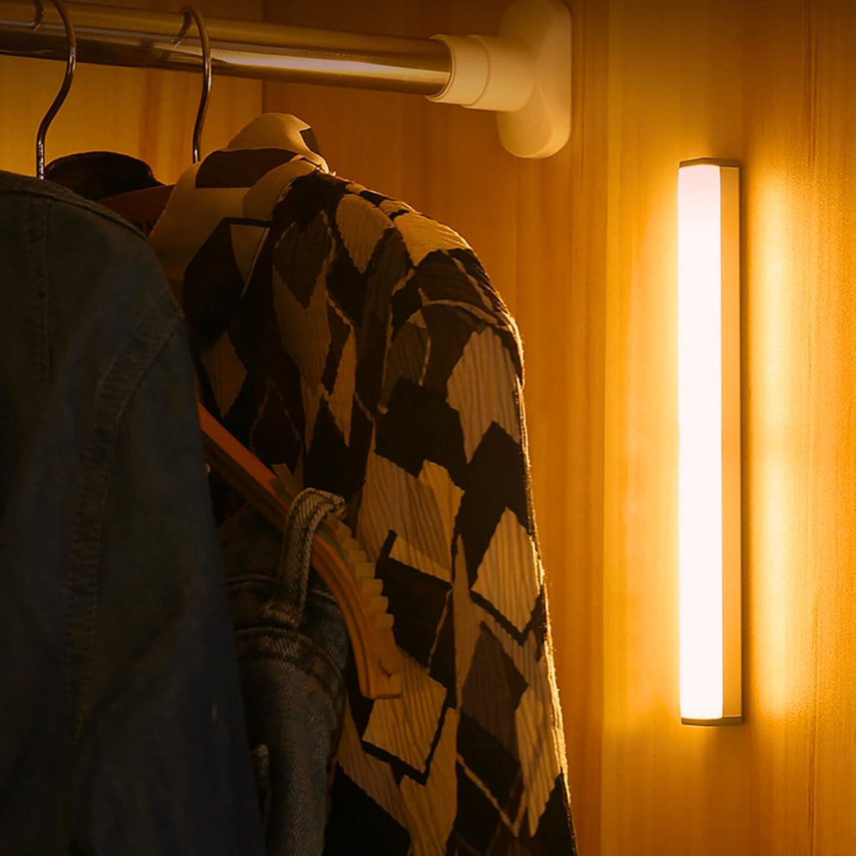 Vertical motion sensor light bar beside clothes in a wardrobe | Casa Norex