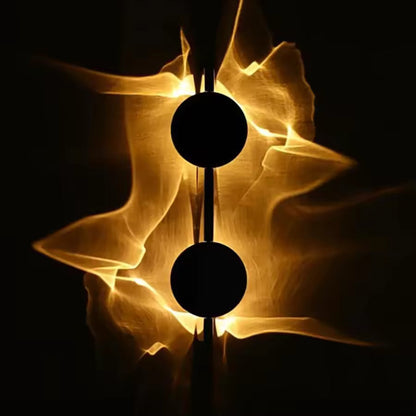 Duo wall sconce with golden ripple glow on a dark wall, two discs on a slim bar — Casa Norex