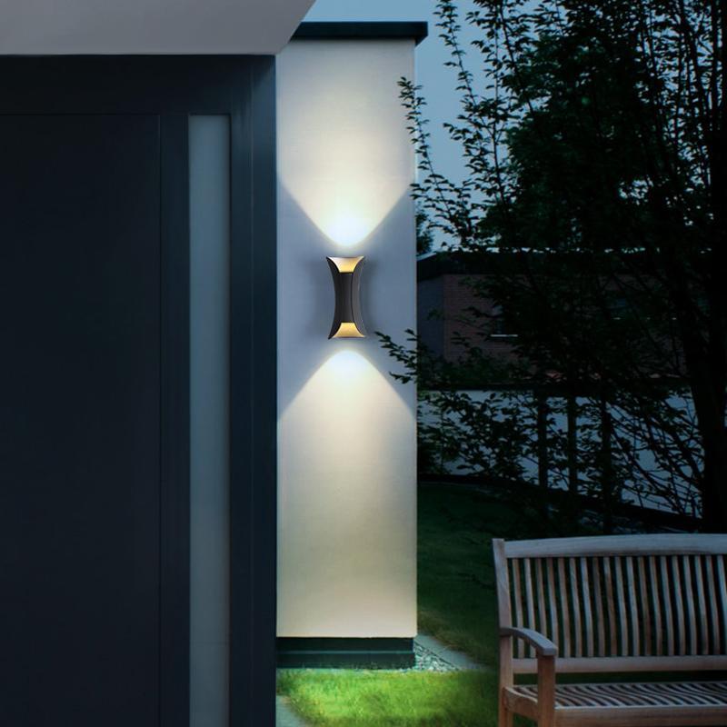 Modern exterior wall light showing dual-beam effect — Casa Norex