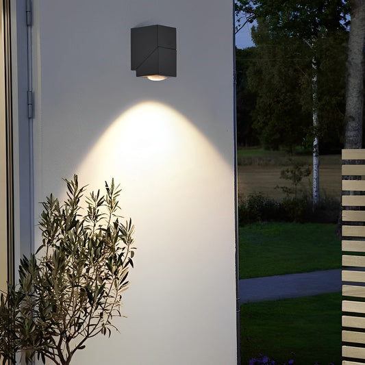 Up down outdoor wall light — adjustable dual light heads on white wall with greenery | Casa Norex