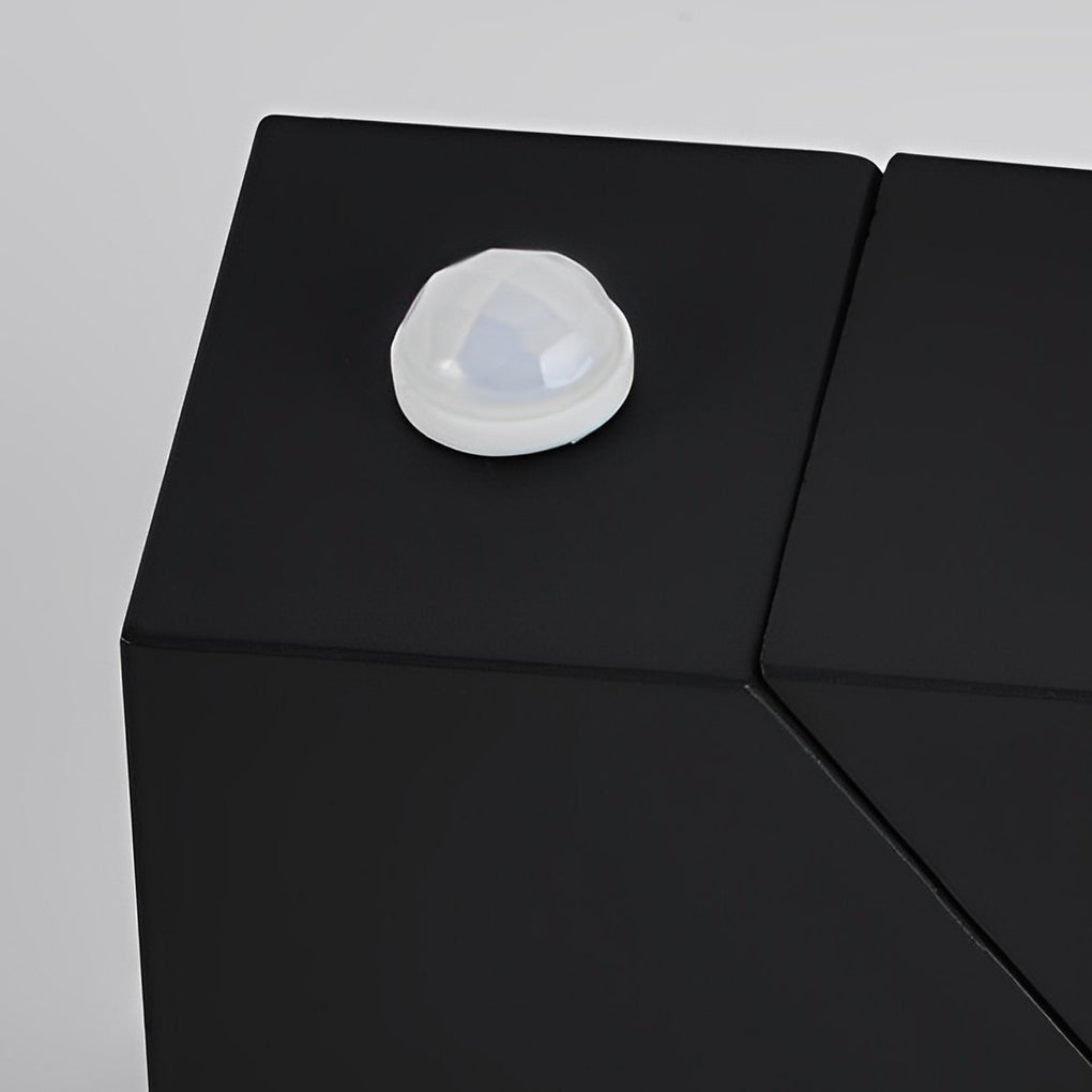 Up down outdoor wall light with geometric shape and warm light on patio — Casa Norex