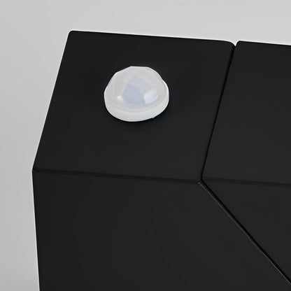 Up down outdoor wall light with geometric shape and warm light on patio — Casa Norex