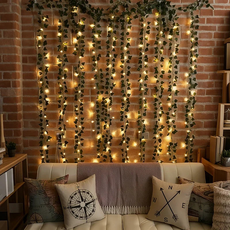 Faux vine garland lights covering a brick wall behind a sofa | Casa Norex