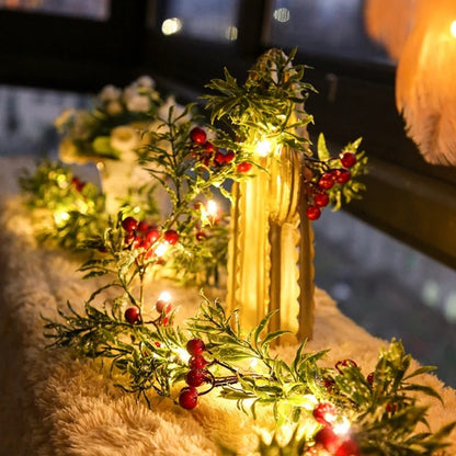 Winterberry garland lights around a lantern and candle centerpiece — Casa Norex