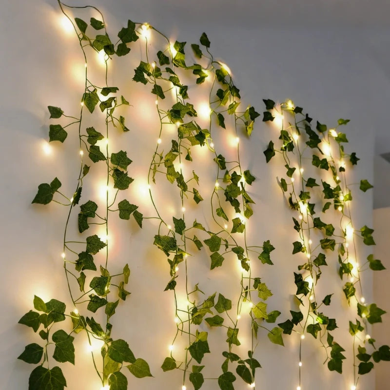 Vine garland lights hanging in loops on a grey wall — Casa Norex