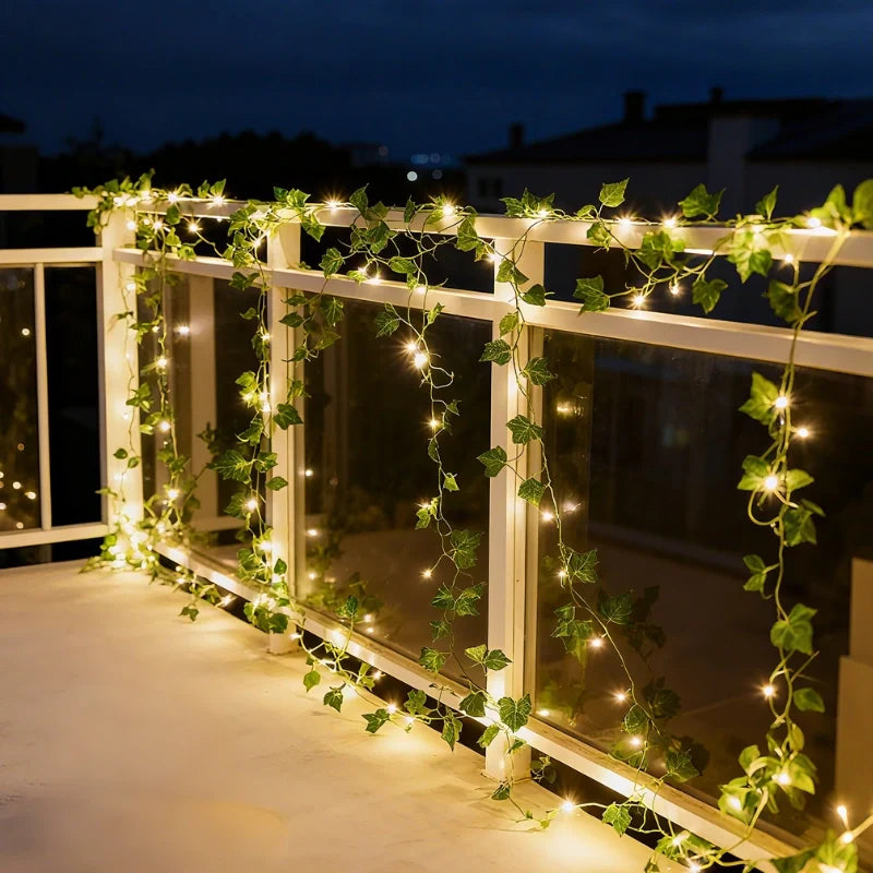 Garland lights wrapped along a balcony railing at night — Casa Norex