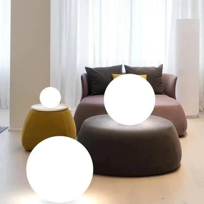 Globe light resting on built-in clasp, standing on table — Casa Norex