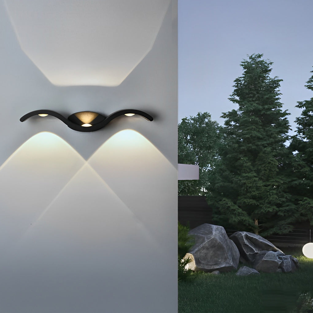 Wall sconce lit at night on patio wall — Casa Norex