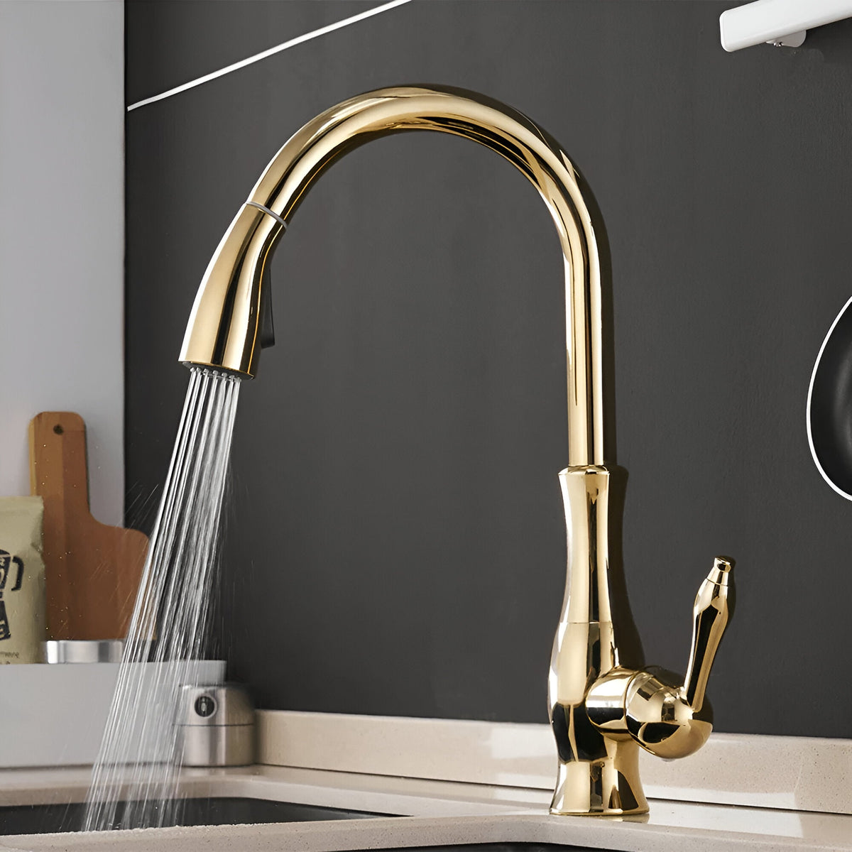 Aurelia Pull-Out Kitchen Faucet — polished gold finish in use | Casa Norex